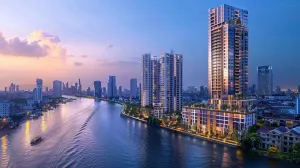 Modern high-rise condos along the Bangkok river at twilight.