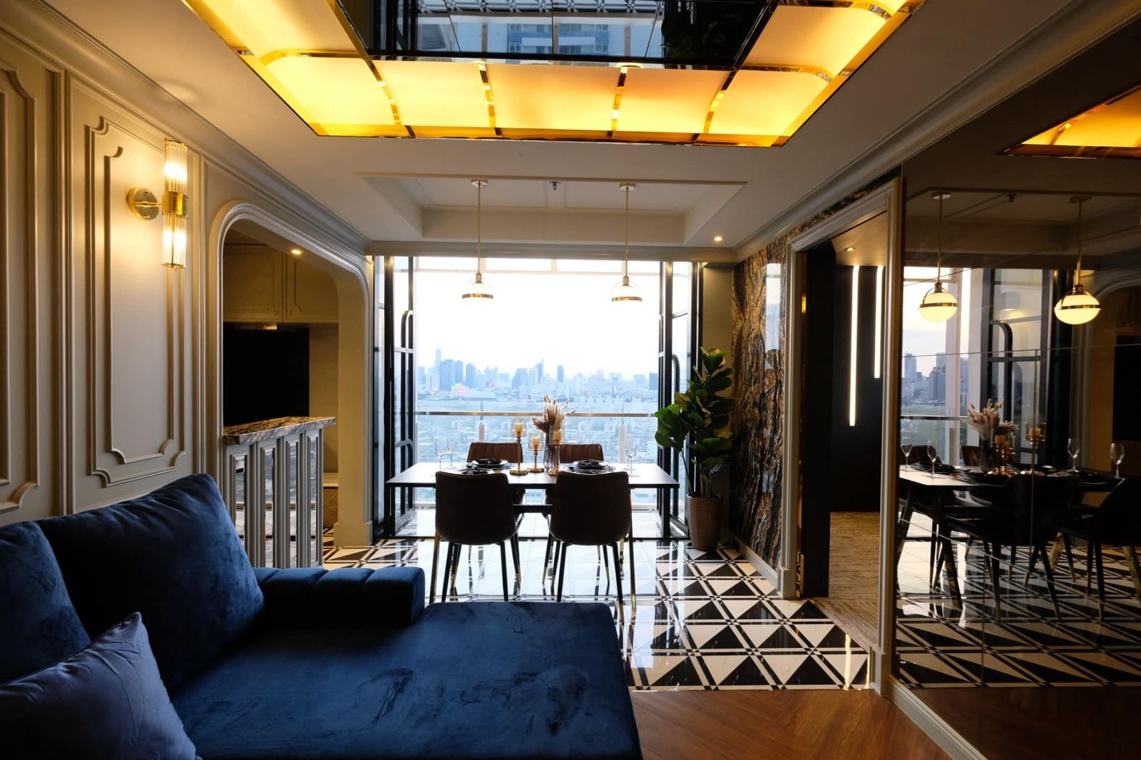 Dining area with city skyline view and elegant table setting.