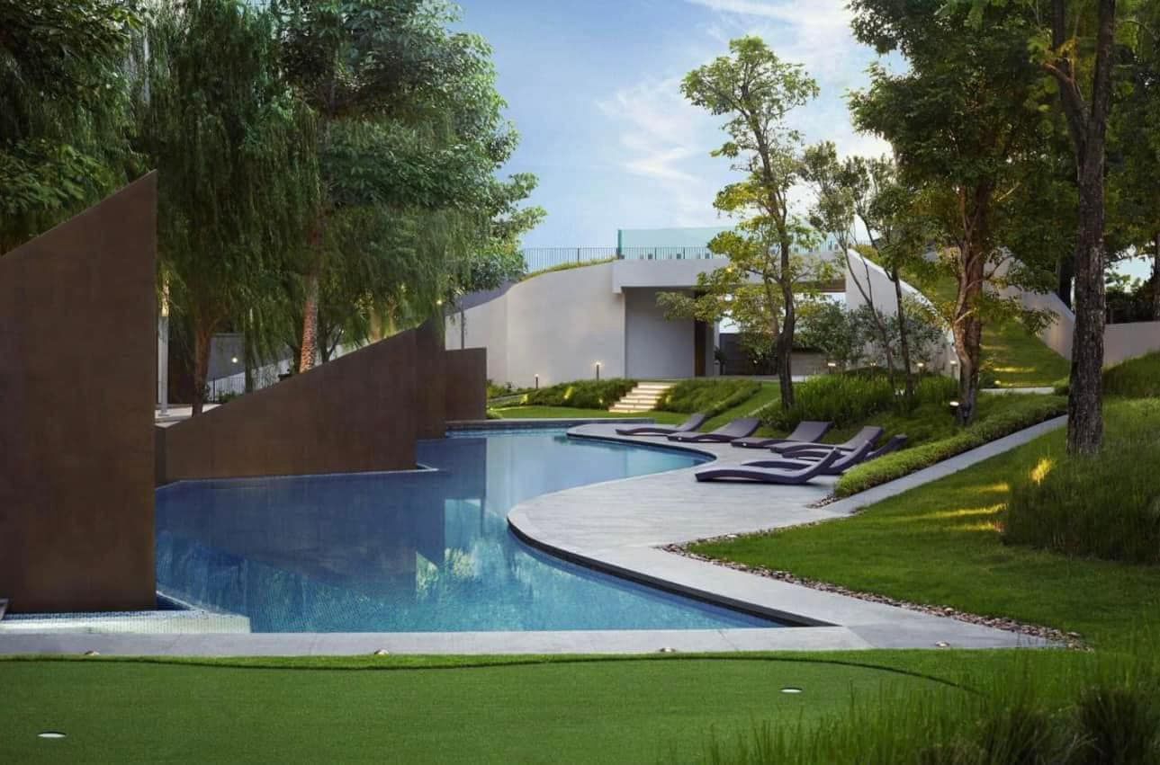 Outdoor pool with modern design surrounded by greenery and sleek architecture.