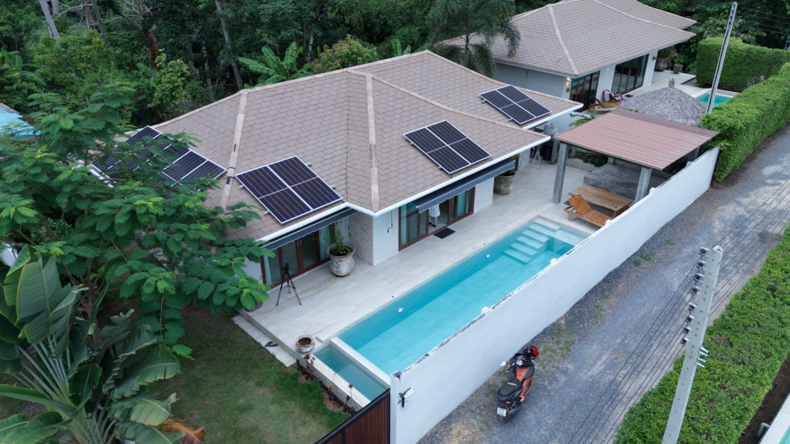 Luxurious 2-bedroom villa with pool in Koh Phangan for sale at 10,5M THB. Features eco-friendly design, solar panels, and serene island living.