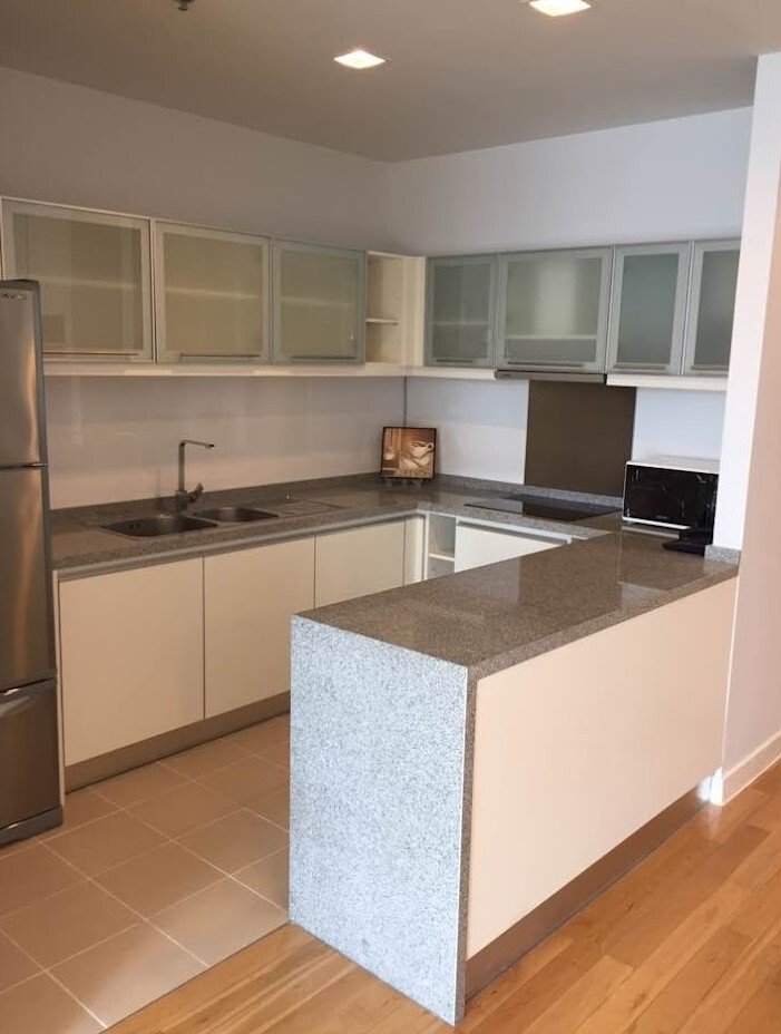 Fully furnished 2-bedroom, 2-bathroom condo at Millennium Residence, 92 sqm, 37th floor with unblocked city views, modern Western kitchen, and luxury amenities.