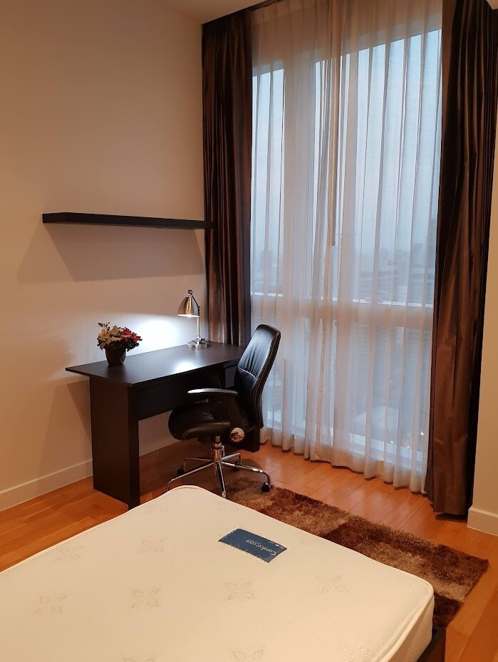 Fully furnished 2-bedroom, 2-bathroom condo at Millennium Residence, 92 sqm, 37th floor with unblocked city views, modern Western kitchen, and luxury amenities.