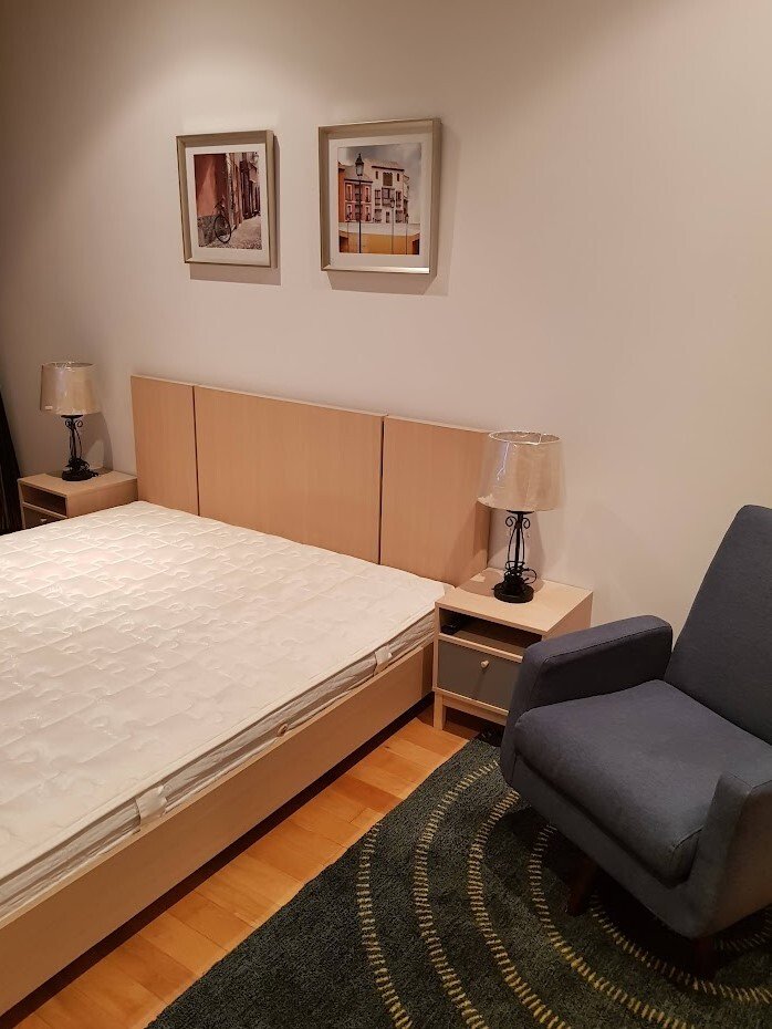 Fully furnished 2-bedroom, 2-bathroom condo at Millennium Residence, 92 sqm, 37th floor with unblocked city views, modern Western kitchen, and luxury amenities.