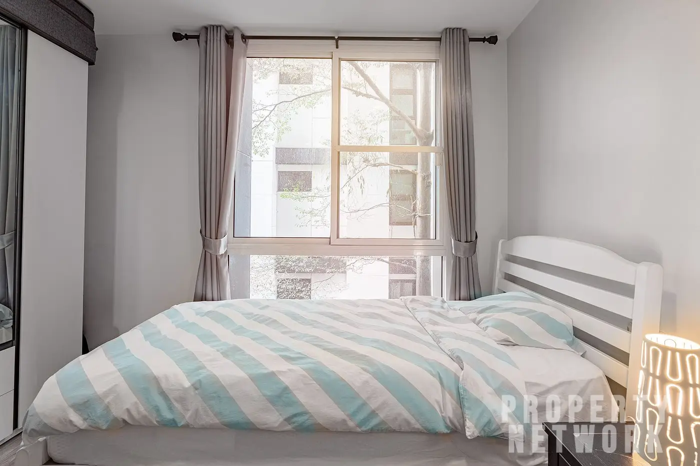 Spacious 2-bedroom, 2-bathroom condo at D 65 Condominium, 67.8 sqm, fully furnished with a balcony, modern kitchen, and amenities near BTS Ekkamai.