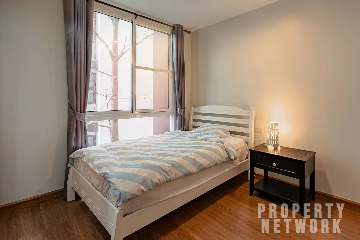 Spacious 2-bedroom, 2-bathroom condo at D 65 Condominium, 67.8 sqm, fully furnished with a balcony, modern kitchen, and amenities near BTS Ekkamai.