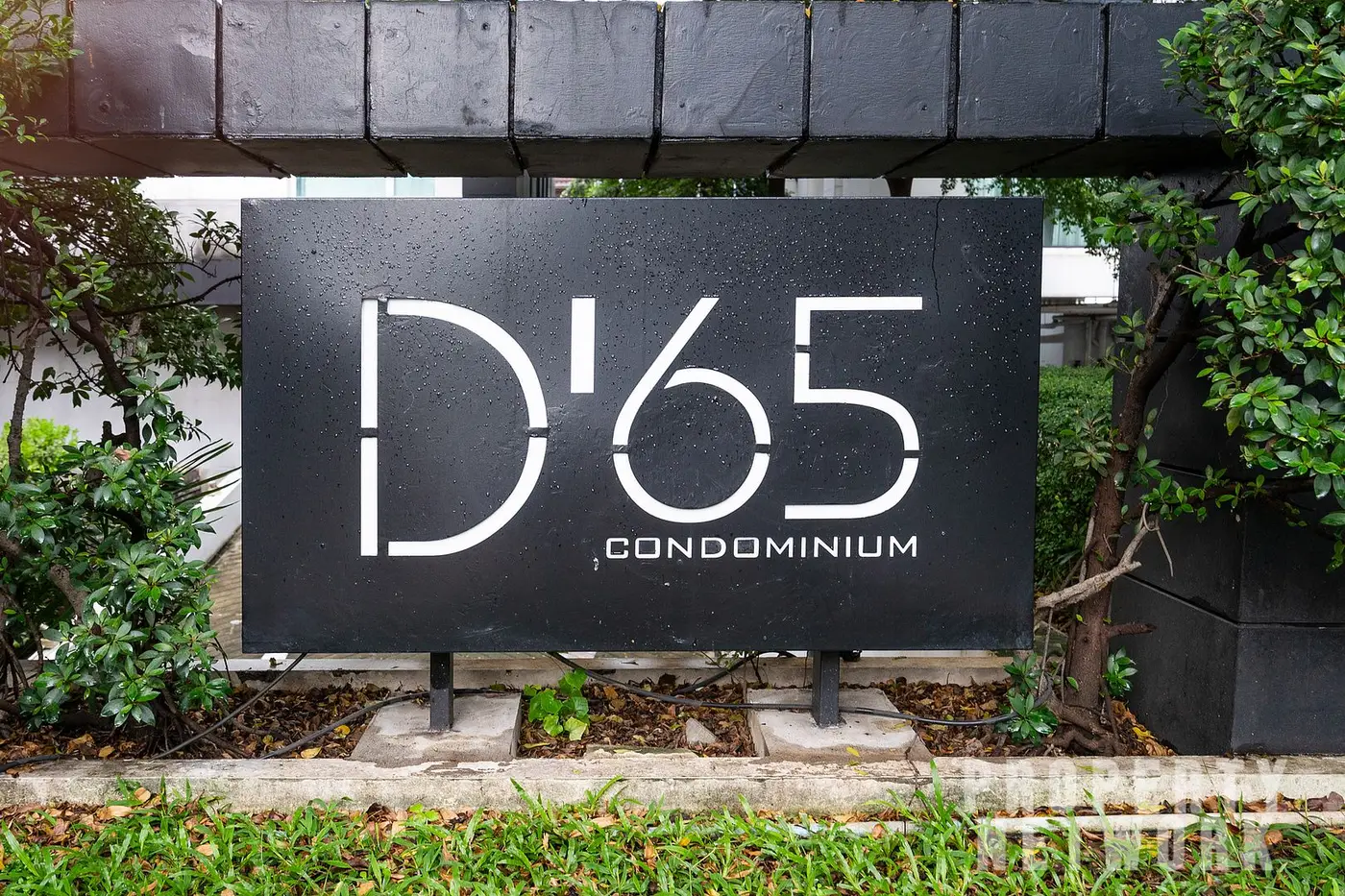 Spacious 2-bedroom, 2-bathroom condo at D 65 Condominium, 67.8 sqm, fully furnished with a balcony, modern kitchen, and amenities near BTS Ekkamai.