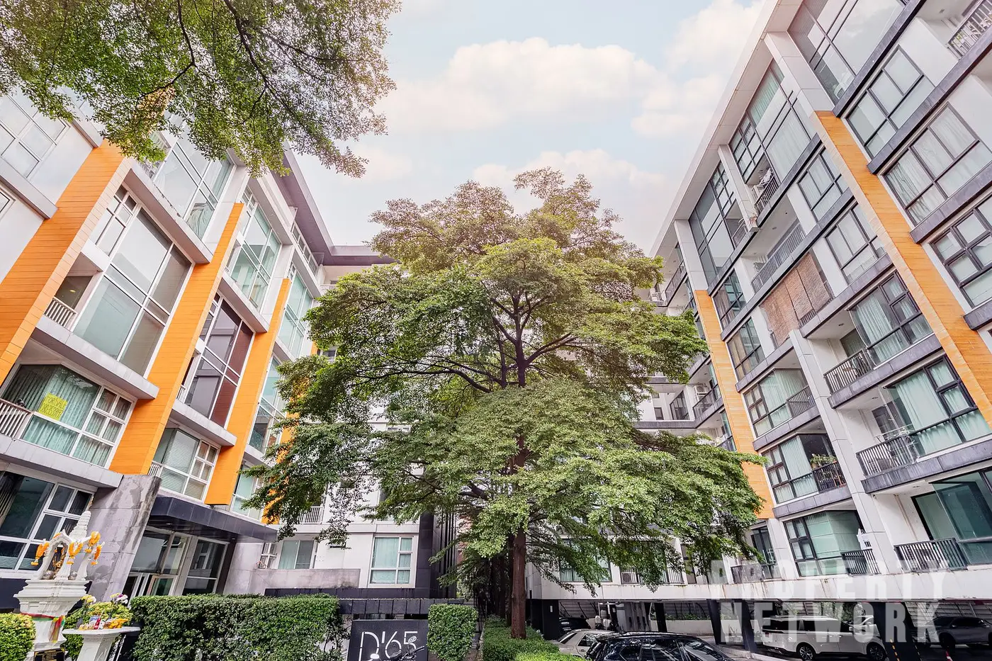 Spacious 2-bedroom, 2-bathroom condo at D 65 Condominium, 67.8 sqm, fully furnished with a balcony, modern kitchen, and amenities near BTS Ekkamai.