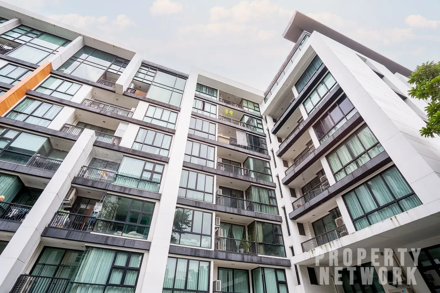 Spacious 2-bedroom, 2-bathroom condo at D 65 Condominium, 67.8 sqm, fully furnished with a balcony, modern kitchen, and amenities near BTS Ekkamai.