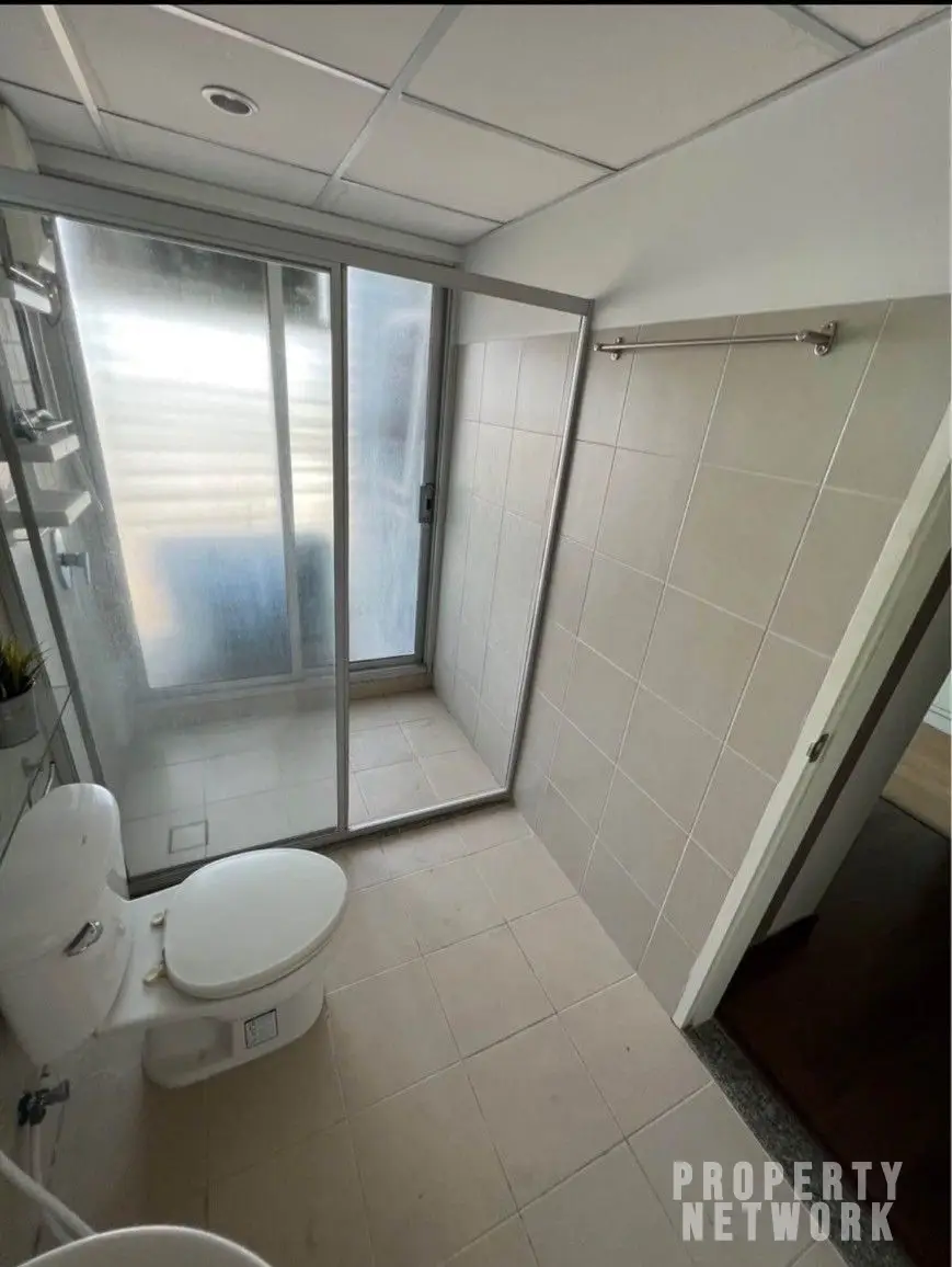 Fully furnished 2-bedroom, 1-bathroom condo at Supalai Park Ekamai Thonglor, 83 sqm, 19th floor, with city views, swimming pool, gym, and rooftop terrace.