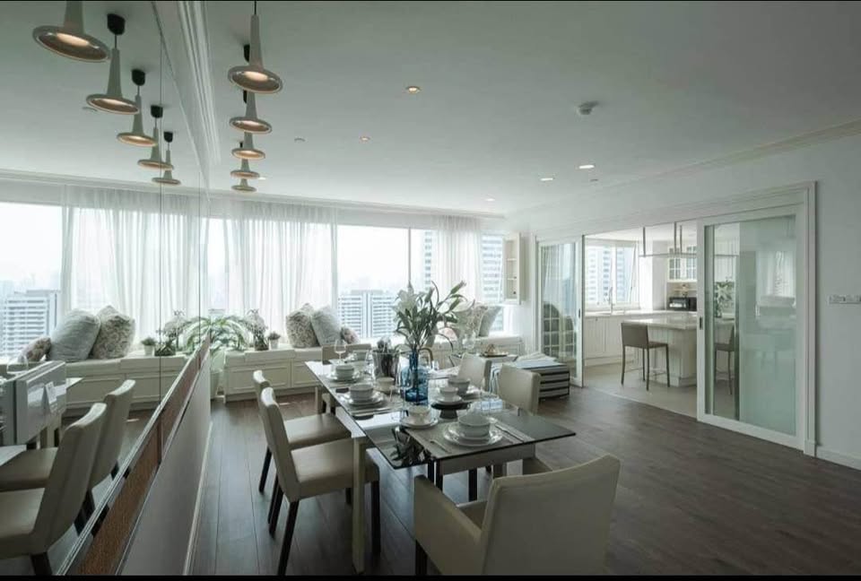 Spacious 4-bedroom penthouse at Wilshire Condominium, featuring modern interiors, skyline views, private balcony, and high-end amenities in Sukhumvit 22, Bangkok.