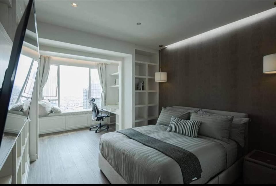 Spacious 4-bedroom penthouse at Wilshire Condominium, featuring modern interiors, skyline views, private balcony, and high-end amenities in Sukhumvit 22, Bangkok.