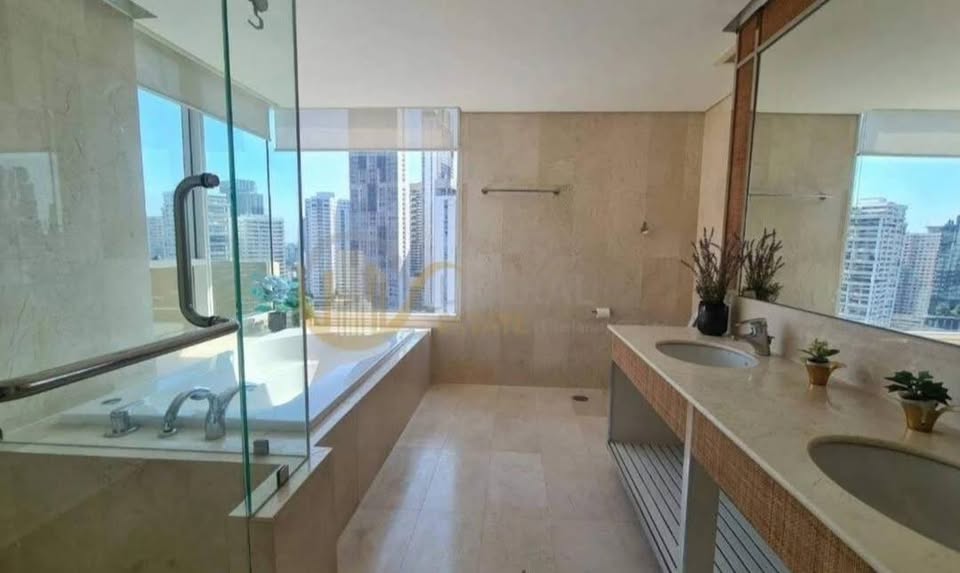 Spacious 4-bedroom penthouse at Wilshire Condominium, featuring modern interiors, skyline views, private balcony, and high-end amenities in Sukhumvit 22, Bangkok.