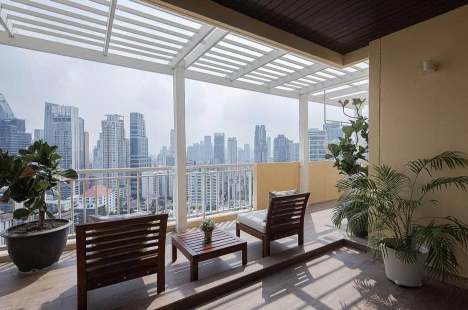 Spacious 4-bedroom penthouse at Wilshire Condominium, featuring modern interiors, skyline views, private balcony, and high-end amenities in Sukhumvit 22, Bangkok.