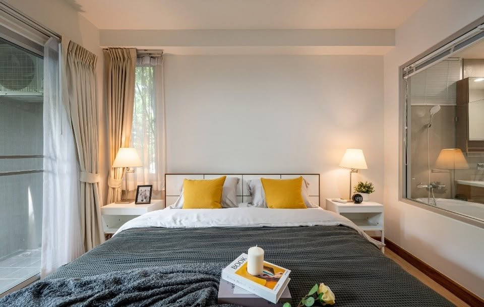 Modern 2-bedroom condo at The Seed Muse 26 with private garden, stylish interiors, and direct pool access in Sukhumvit 26, Bangkok.