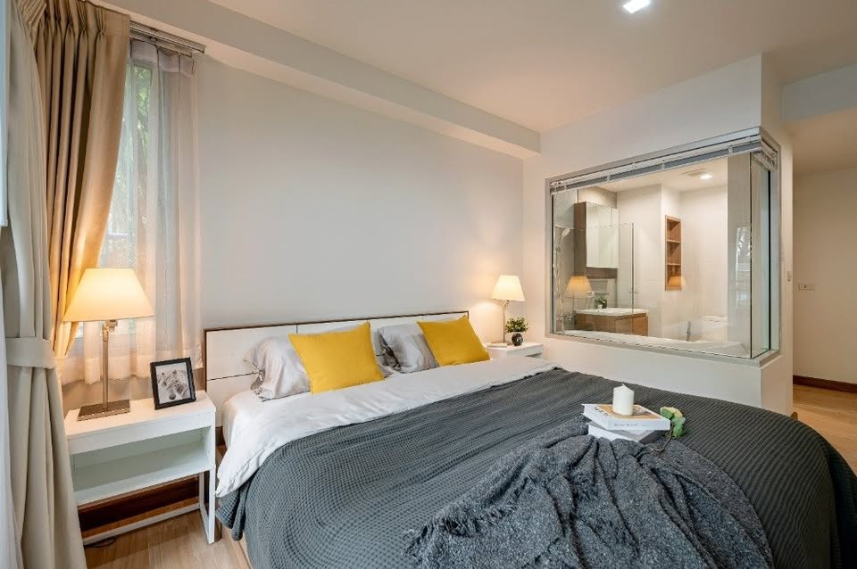 Modern 2-bedroom condo at The Seed Muse 26 with private garden, stylish interiors, and direct pool access in Sukhumvit 26, Bangkok.