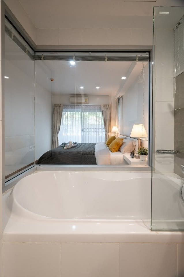 Modern 2-bedroom condo at The Seed Muse 26 with private garden, stylish interiors, and direct pool access in Sukhumvit 26, Bangkok.
