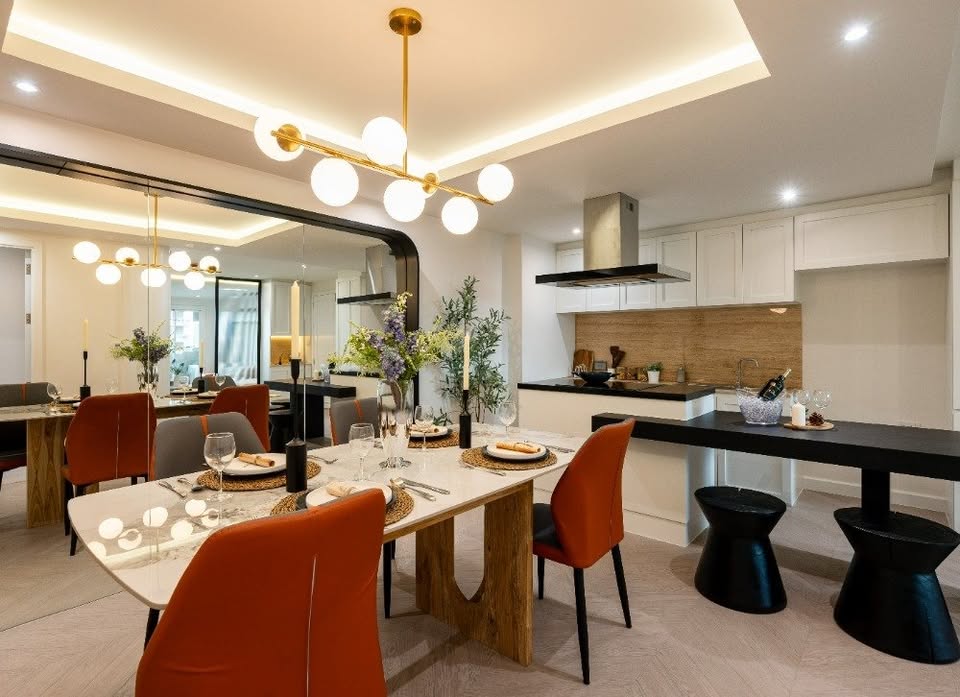 Top-floor corner unit at Le Nice Ekamai featuring a spacious 3-bedroom layout, modern western kitchen with island, and panoramic city views.