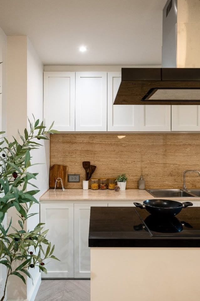 Top-floor corner unit at Le Nice Ekamai featuring a spacious 3-bedroom layout, modern western kitchen with island, and panoramic city views.