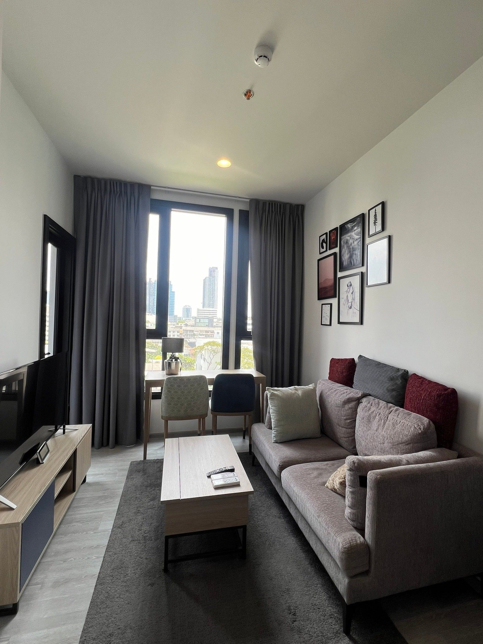 Modern 1-bedroom condo at XT Ekkamai, fully furnished with smart home features, city views, and premium amenities, including a rooftop pool and co-working spaces.
