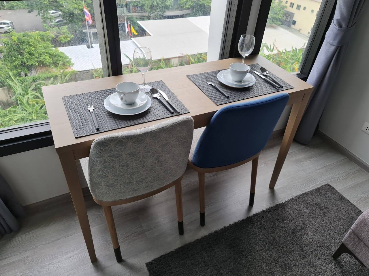 Modern 1-bedroom condo at XT Ekkamai, fully furnished with smart home features, city views, and premium amenities, including a rooftop pool and co-working spaces.