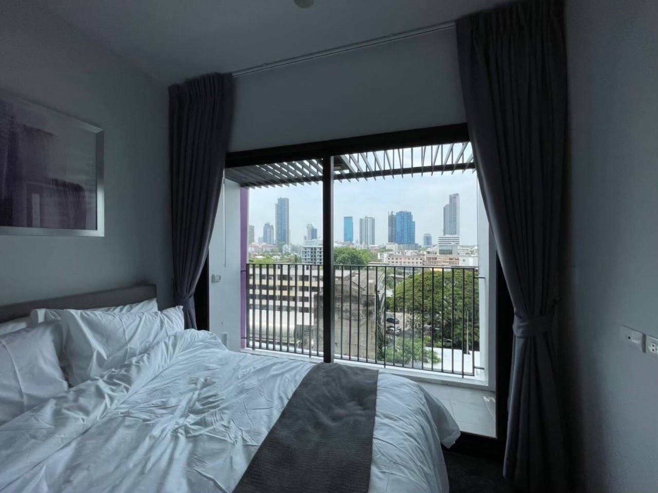 Modern 1-bedroom condo at XT Ekkamai, fully furnished with smart home features, city views, and premium amenities, including a rooftop pool and co-working spaces.
