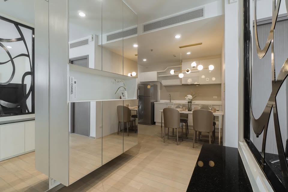 Elegant 2-bedroom condo at Pyne by Sansiri, featuring stylish furnishings, high-floor city views, and premium facilities, located next to BTS Ratchathewi.
