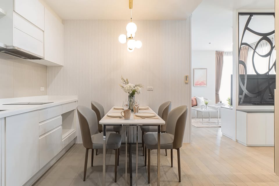 Elegant 2-bedroom condo at Pyne by Sansiri, featuring stylish furnishings, high-floor city views, and premium facilities, located next to BTS Ratchathewi.