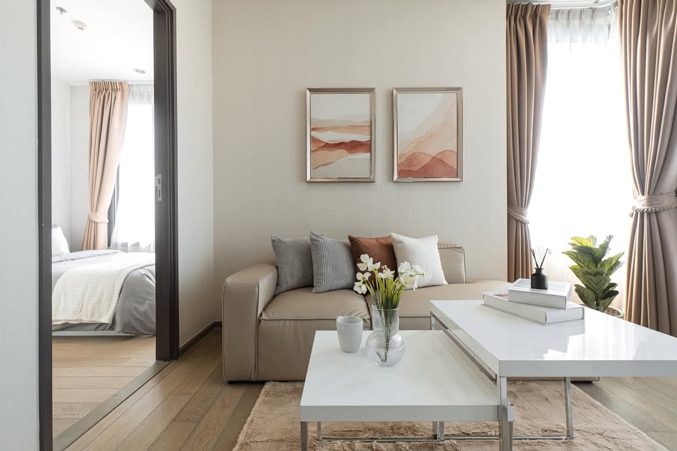 Elegant 2-bedroom condo at Pyne by Sansiri, featuring stylish furnishings, high-floor city views, and premium facilities, located next to BTS Ratchathewi.
