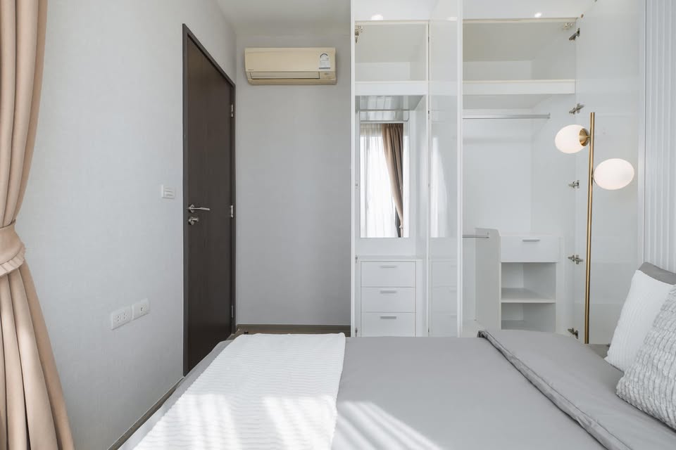 Elegant 2-bedroom condo at Pyne by Sansiri, featuring stylish furnishings, high-floor city views, and premium facilities, located next to BTS Ratchathewi.