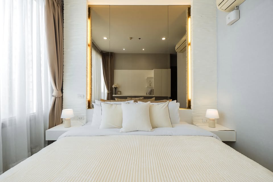 Elegant 2-bedroom condo at Pyne by Sansiri, featuring stylish furnishings, high-floor city views, and premium facilities, located next to BTS Ratchathewi.