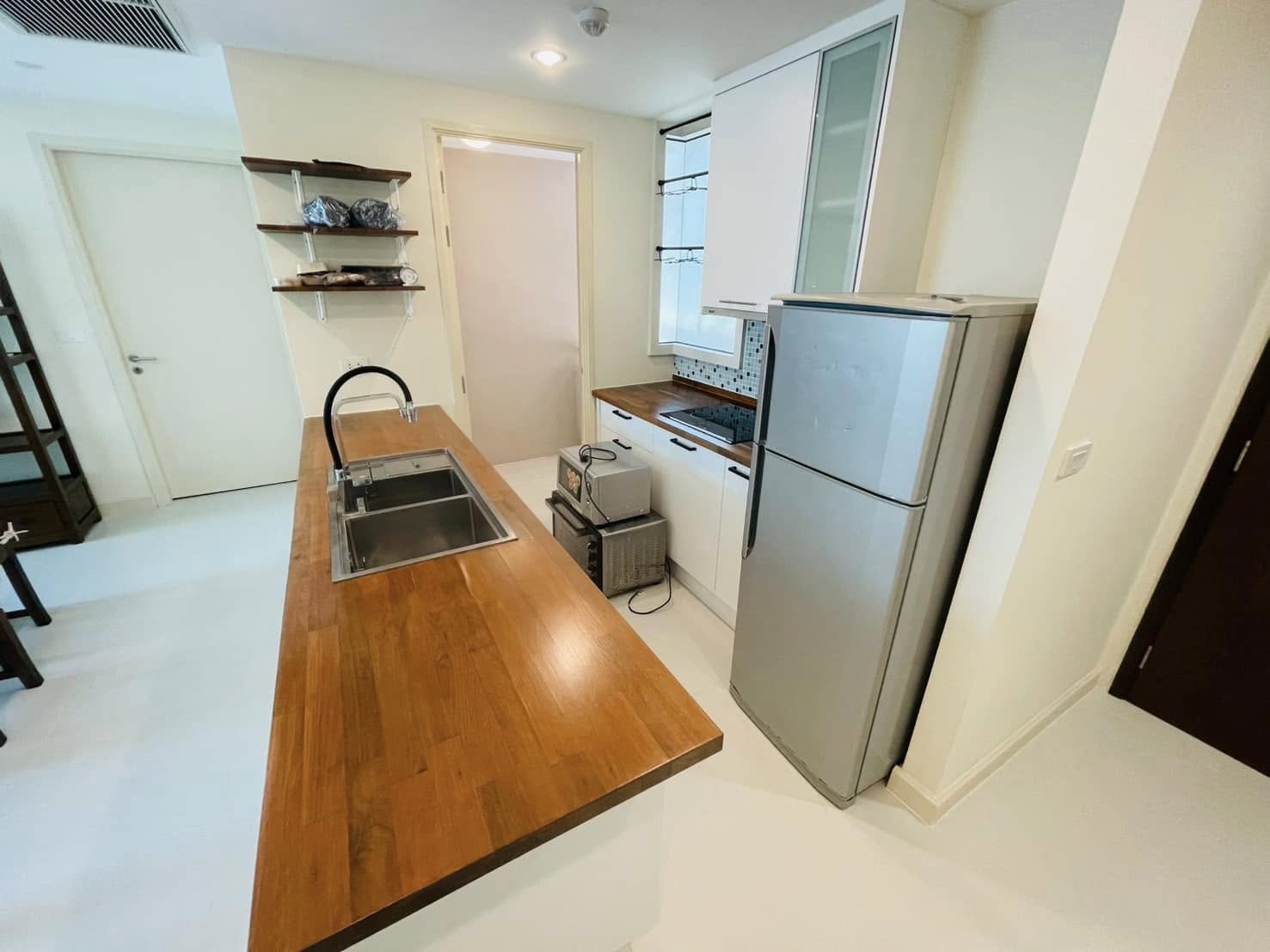 Elegant 2-bedroom condo at Manhattan Chidlom, featuring stylish furnishings, high-floor city views, and premium amenities, located near BTS Chidlom in central Bangkok.