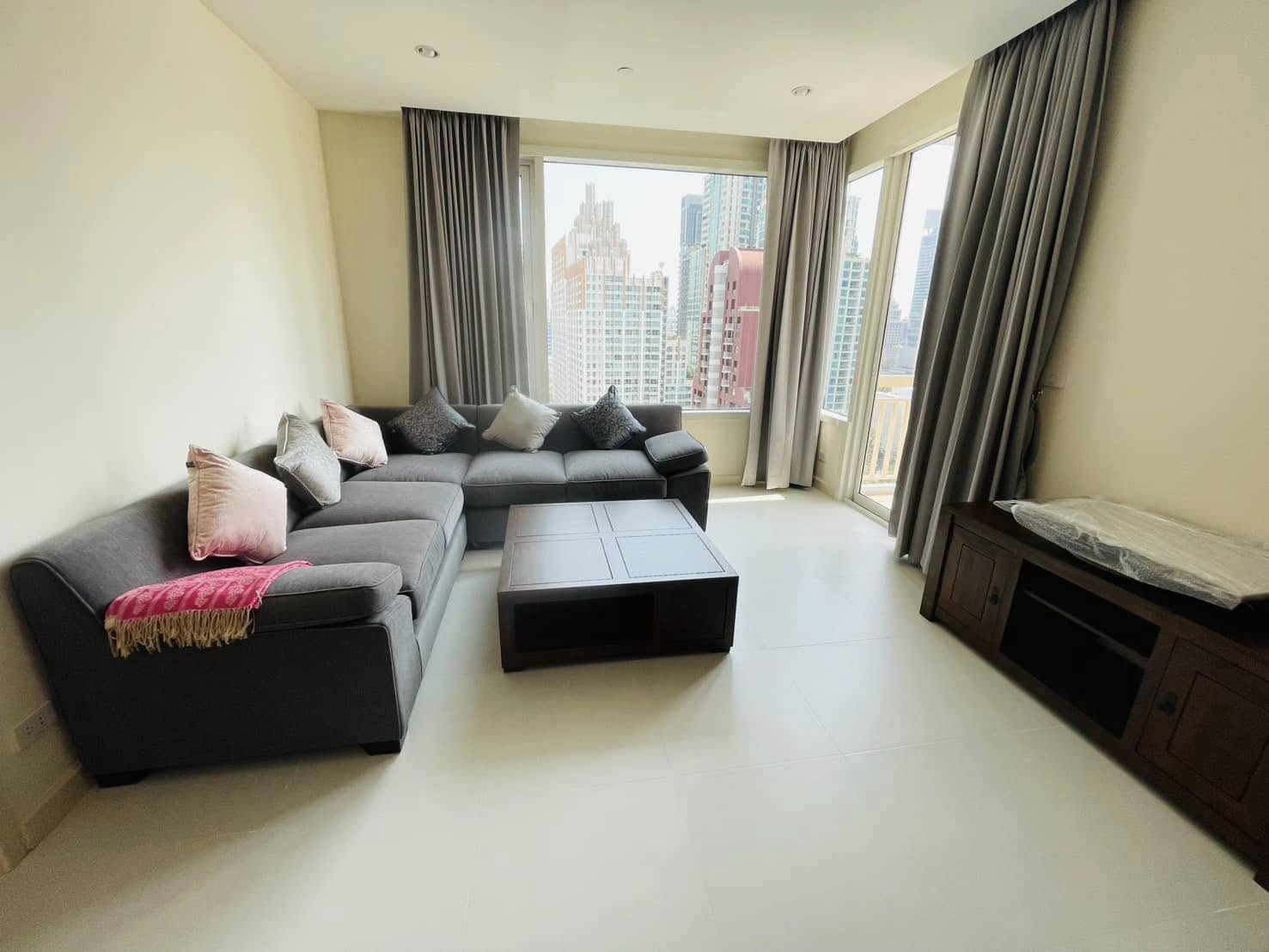 Elegant 2-bedroom condo at Manhattan Chidlom, featuring stylish furnishings, high-floor city views, and premium amenities, located near BTS Chidlom in central Bangkok.