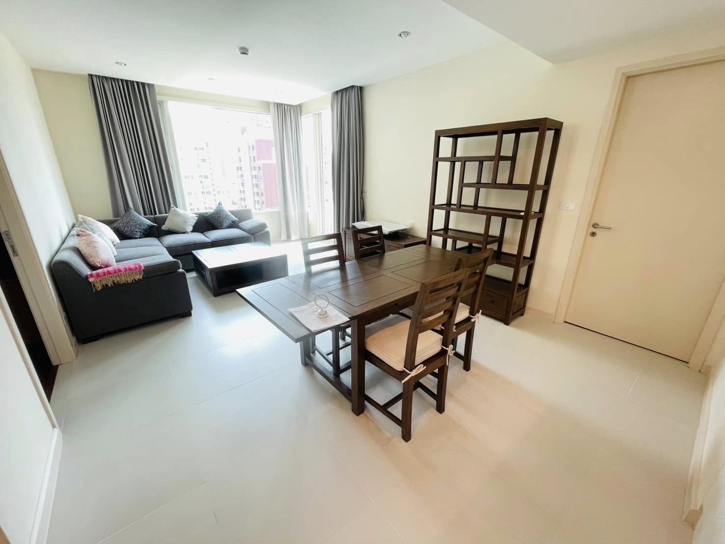 Elegant 2-bedroom condo at Manhattan Chidlom, featuring stylish furnishings, high-floor city views, and premium amenities, located near BTS Chidlom in central Bangkok.