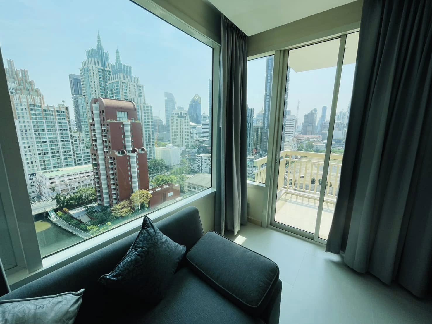 Elegant 2-bedroom condo at Manhattan Chidlom, featuring stylish furnishings, high-floor city views, and premium amenities, located near BTS Chidlom in central Bangkok.