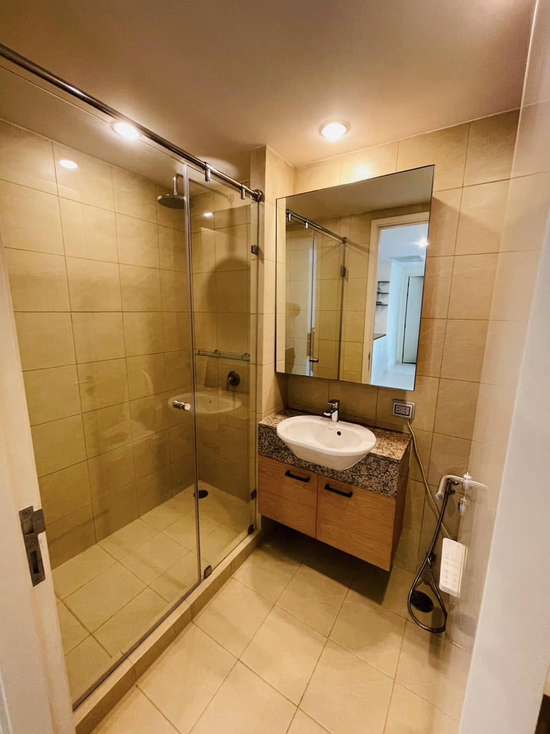 Elegant 2-bedroom condo at Manhattan Chidlom, featuring stylish furnishings, high-floor city views, and premium amenities, located near BTS Chidlom in central Bangkok.