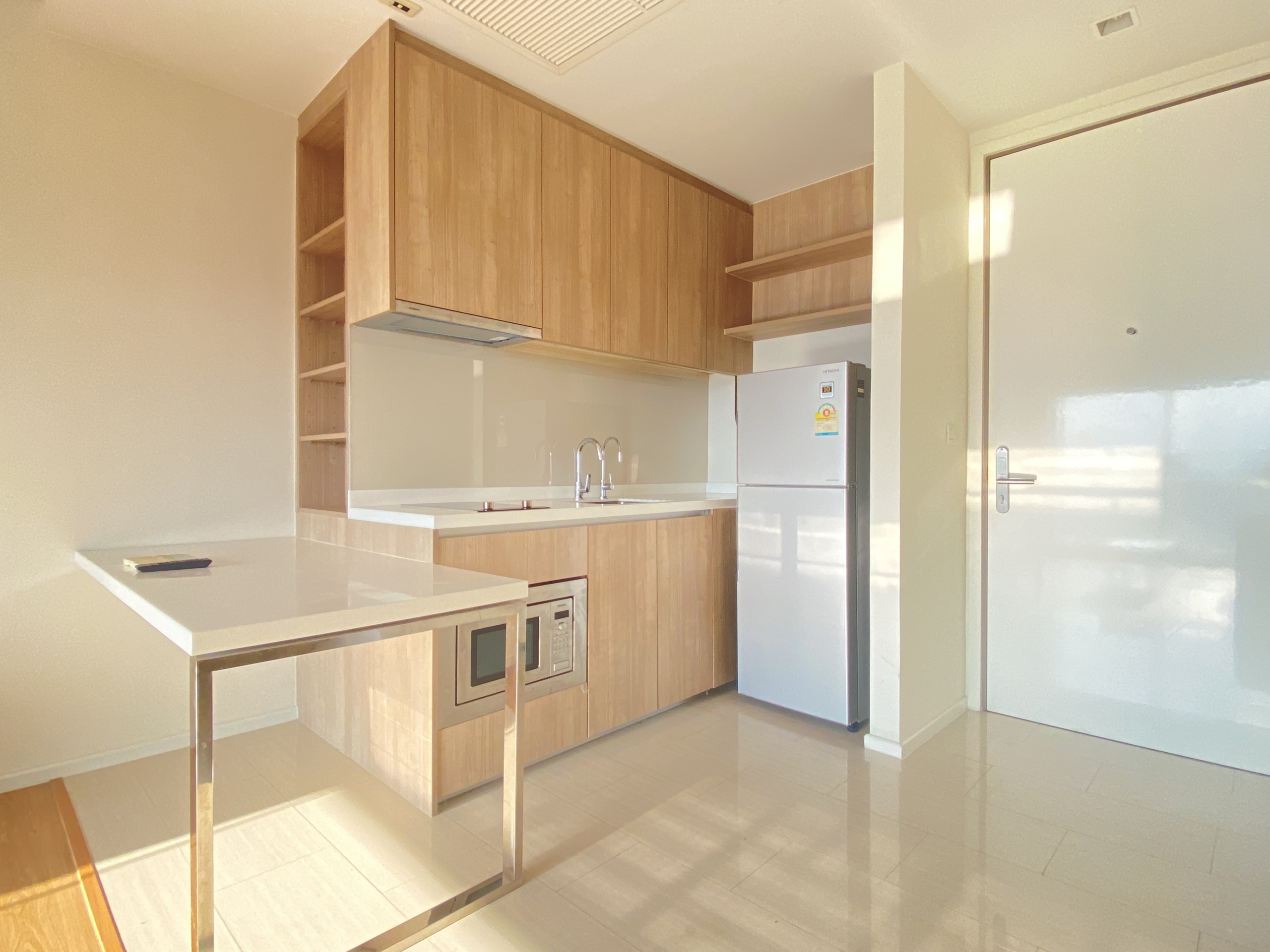 Elegant 1-bedroom condo at Circle Living Prototype with modern furnishings, high-floor city views, and eco-friendly smart home features in Bangkok.