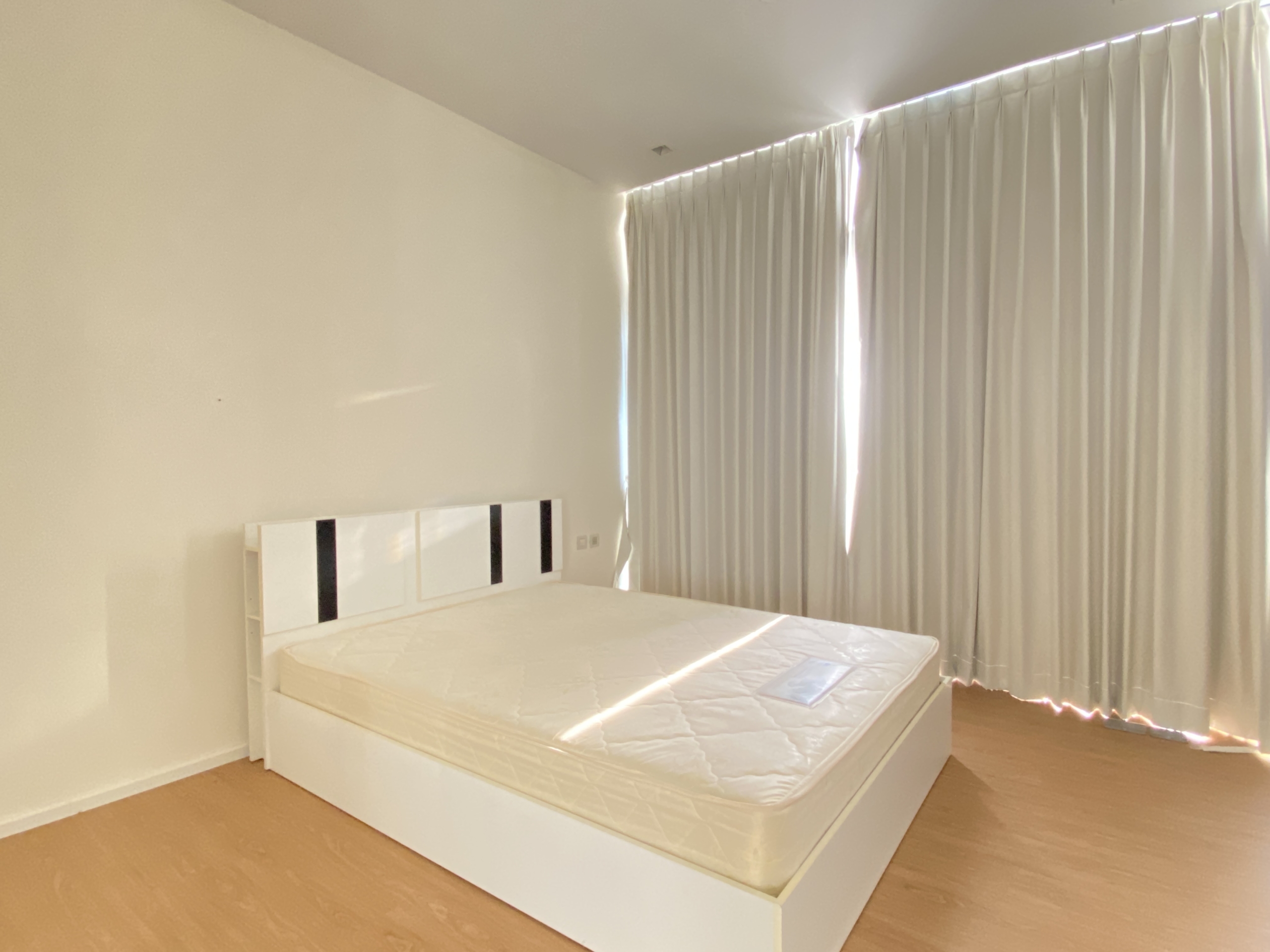 Elegant 1-bedroom condo at Circle Living Prototype with modern furnishings, high-floor city views, and eco-friendly smart home features in Bangkok.