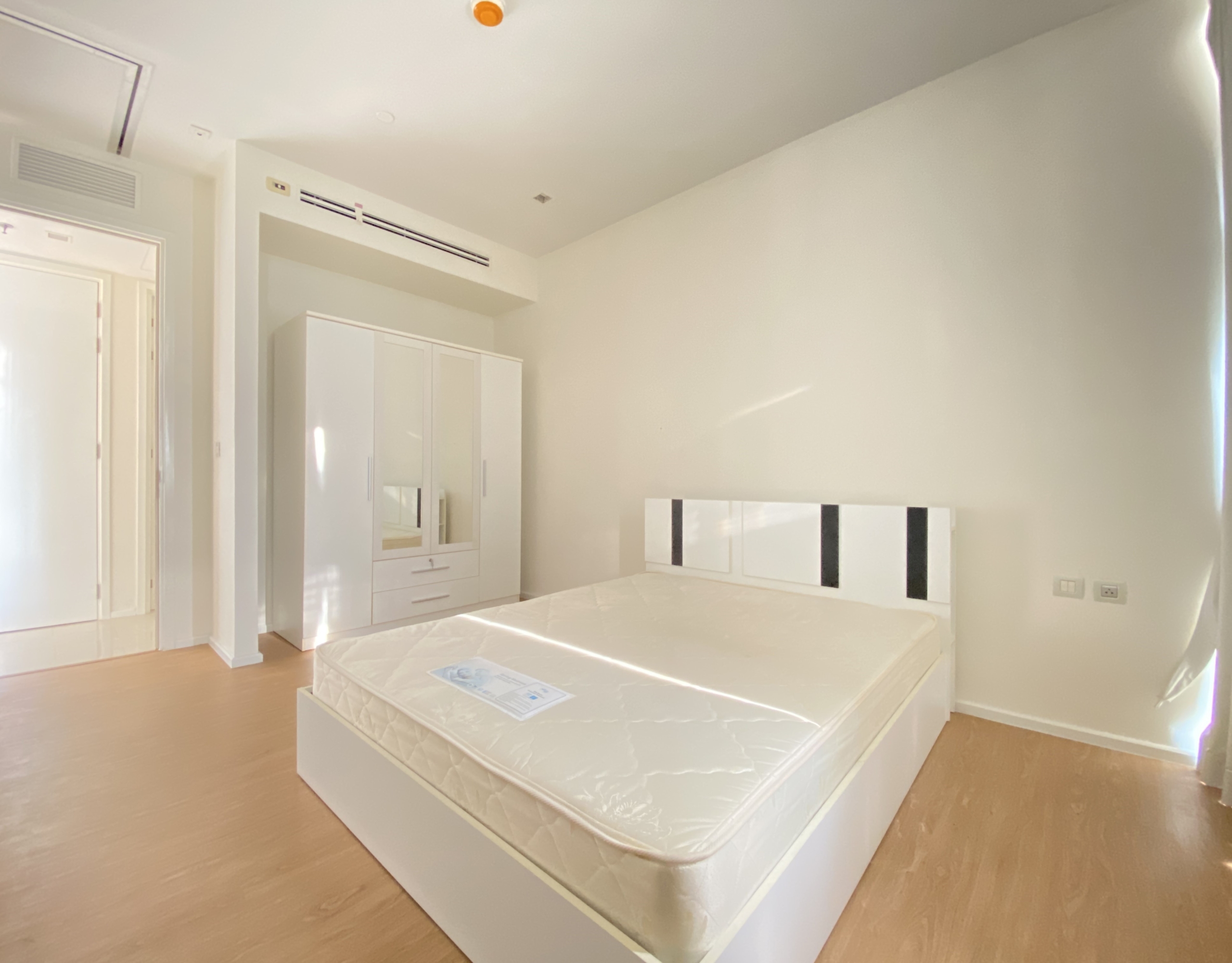 Elegant 1-bedroom condo at Circle Living Prototype with modern furnishings, high-floor city views, and eco-friendly smart home features in Bangkok.