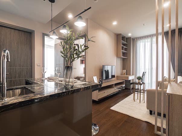 Luxurious 2-bedroom condo at Ideo Q Victory with modern interiors, floor-to-ceiling windows, and panoramic city views from the 31st floor in Bangkok.