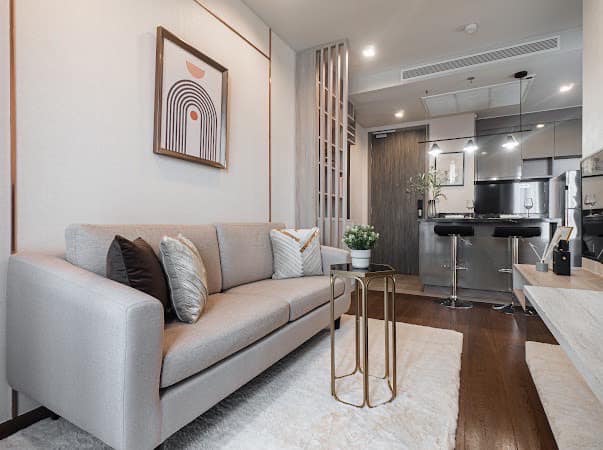 Luxurious 2-bedroom condo at Ideo Q Victory with modern interiors, floor-to-ceiling windows, and panoramic city views from the 31st floor in Bangkok.
