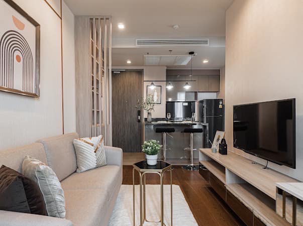 Luxurious 2-bedroom condo at Ideo Q Victory with modern interiors, floor-to-ceiling windows, and panoramic city views from the 31st floor in Bangkok.