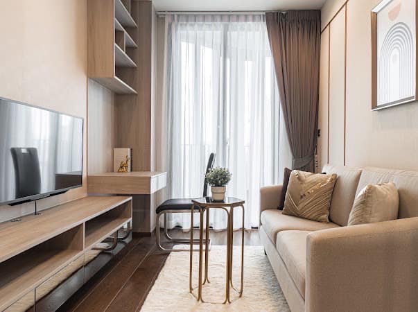 Luxurious 2-bedroom condo at Ideo Q Victory with modern interiors, floor-to-ceiling windows, and panoramic city views from the 31st floor in Bangkok.