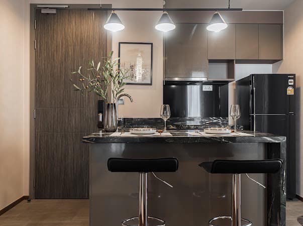Luxurious 2-bedroom condo at Ideo Q Victory with modern interiors, floor-to-ceiling windows, and panoramic city views from the 31st floor in Bangkok.