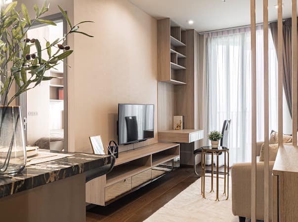 Luxurious 2-bedroom condo at Ideo Q Victory with modern interiors, floor-to-ceiling windows, and panoramic city views from the 31st floor in Bangkok.