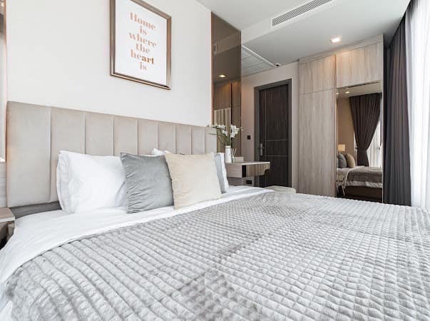 Luxurious 2-bedroom condo at Ideo Q Victory with modern interiors, floor-to-ceiling windows, and panoramic city views from the 31st floor in Bangkok.