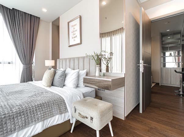 Luxurious 2-bedroom condo at Ideo Q Victory with modern interiors, floor-to-ceiling windows, and panoramic city views from the 31st floor in Bangkok.