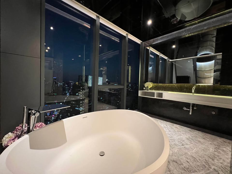 Luxury 3-bed 4-bath 297 sqm condo at MARQUE Sukhumvit with private pool, maid's room, and 4 parking spaces for rent at 700,000 THB monthly near Phrom Phong BTS.