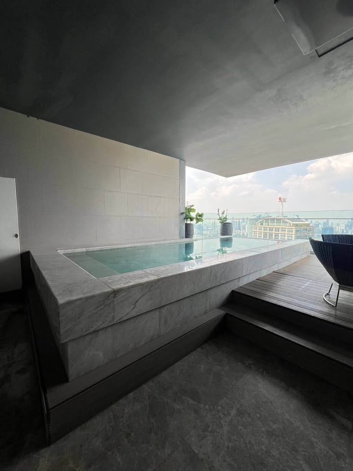 Luxury 3-bed 4-bath 297 sqm condo at MARQUE Sukhumvit with private pool, maid's room, and 4 parking spaces for rent at 700,000 THB monthly near Phrom Phong BTS.