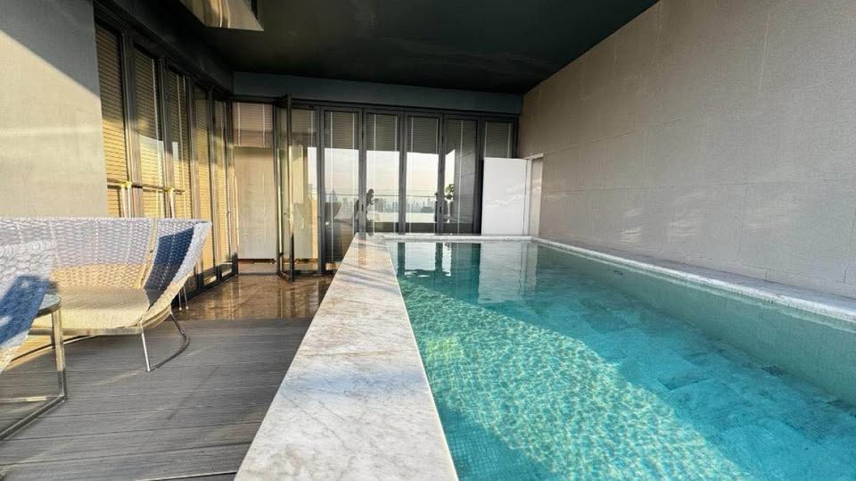 Luxury 3-bed 4-bath 297 sqm condo at MARQUE Sukhumvit with private pool, maid's room, and 4 parking spaces for rent at 700,000 THB monthly near Phrom Phong BTS.