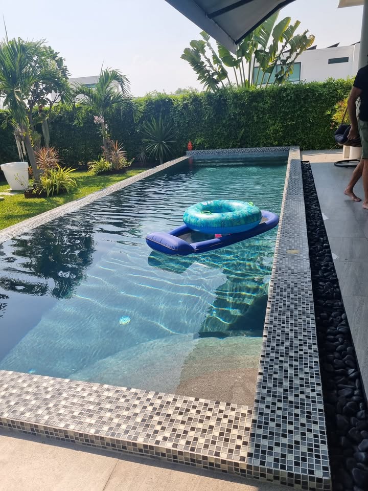 Stunning 4-bedroom pool villa in Soi 112, Hua Hin for sale. Solar power system, private saltwater pool, and resort-style amenities. Price: 15,000,000 THB.